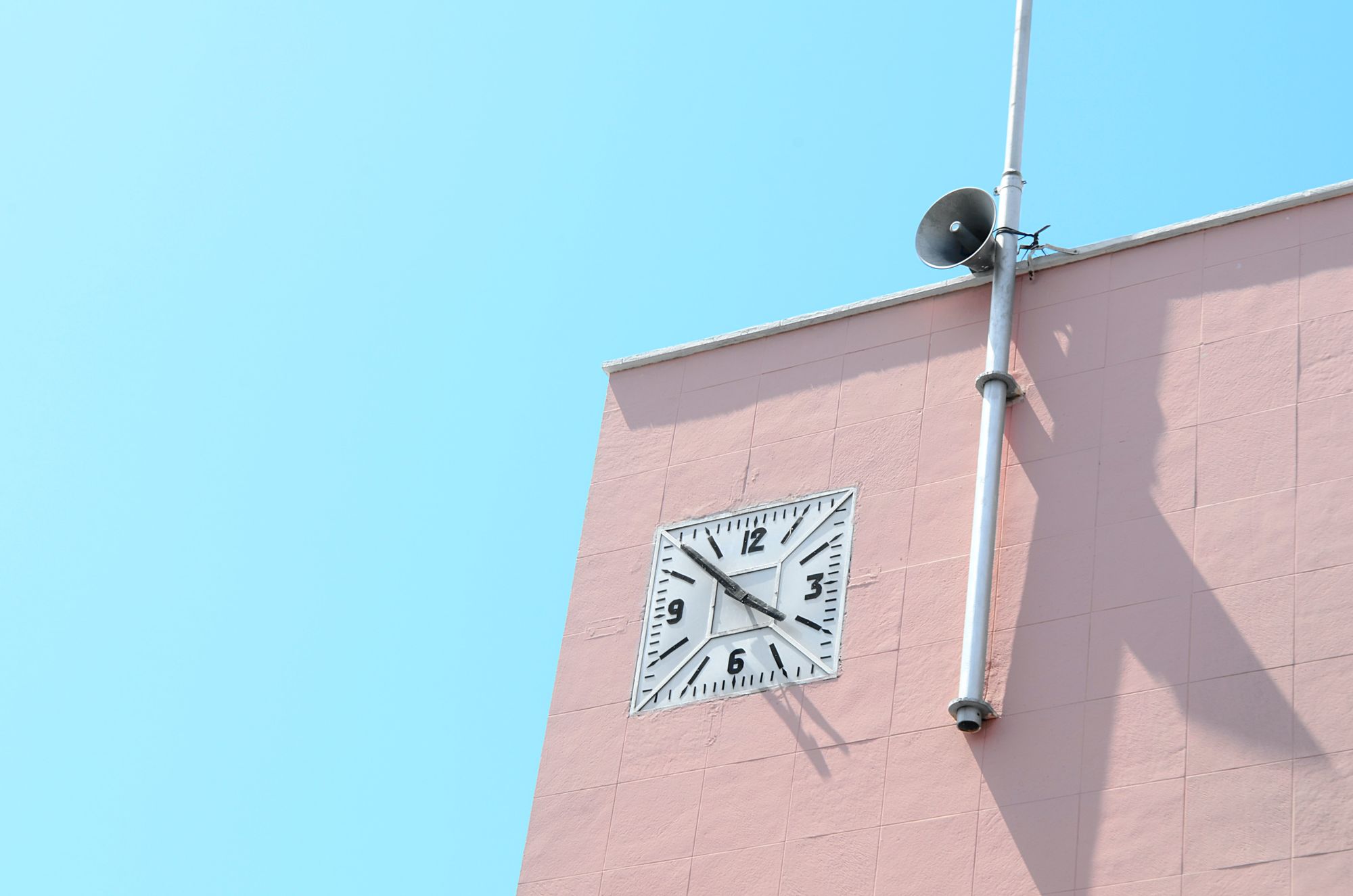 Stock photo of a pink clock.