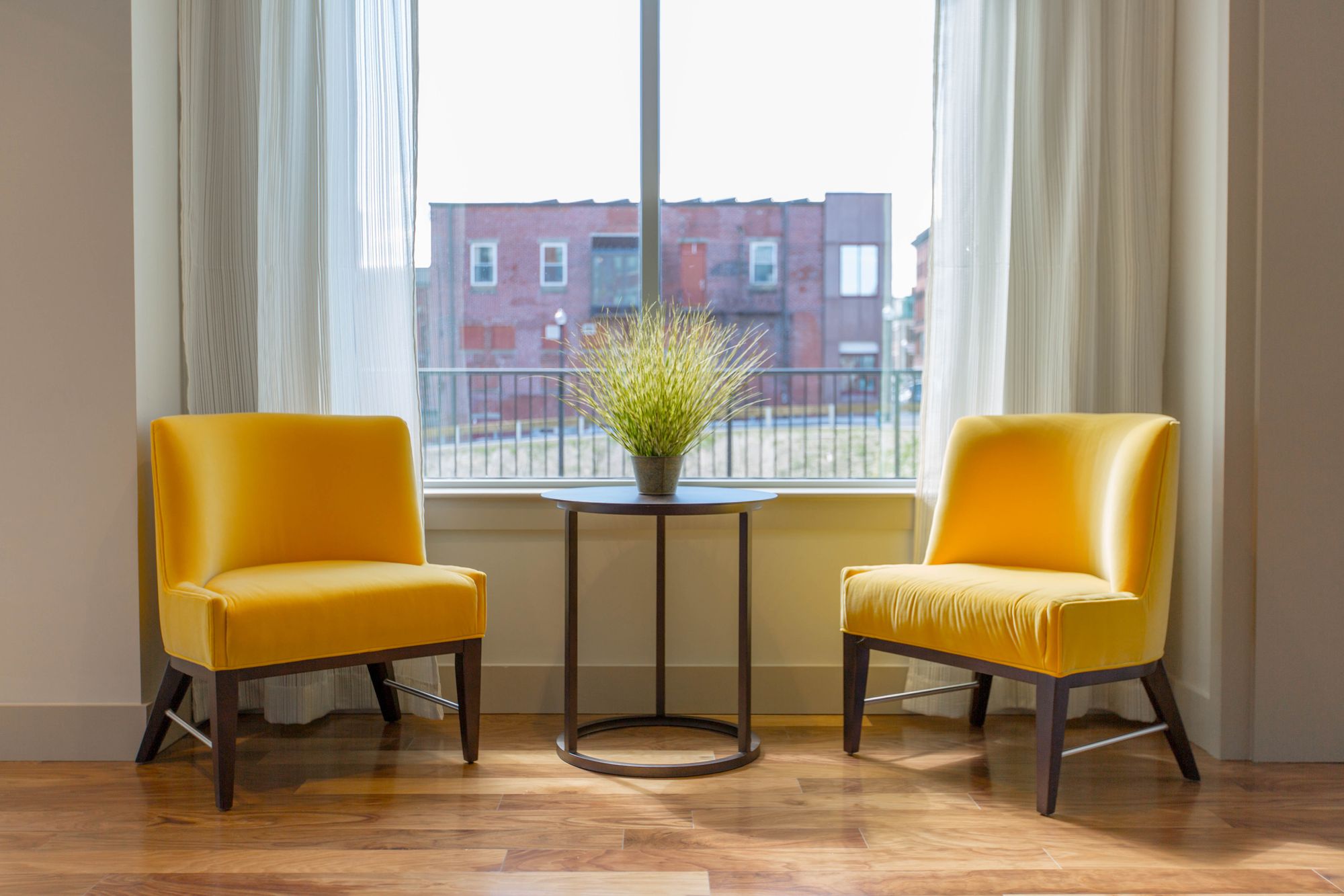 Stock photo of two yellow chairs.