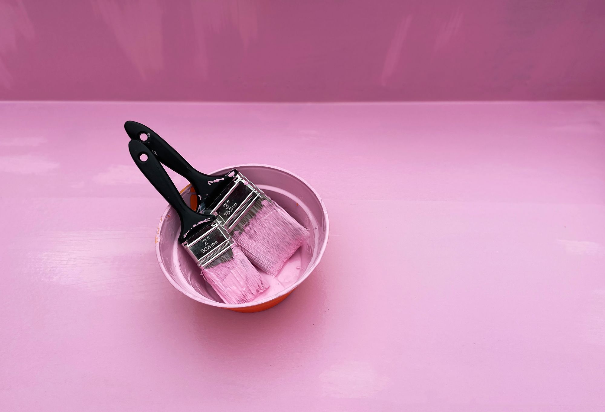 Stock photo of pink paint brushes.