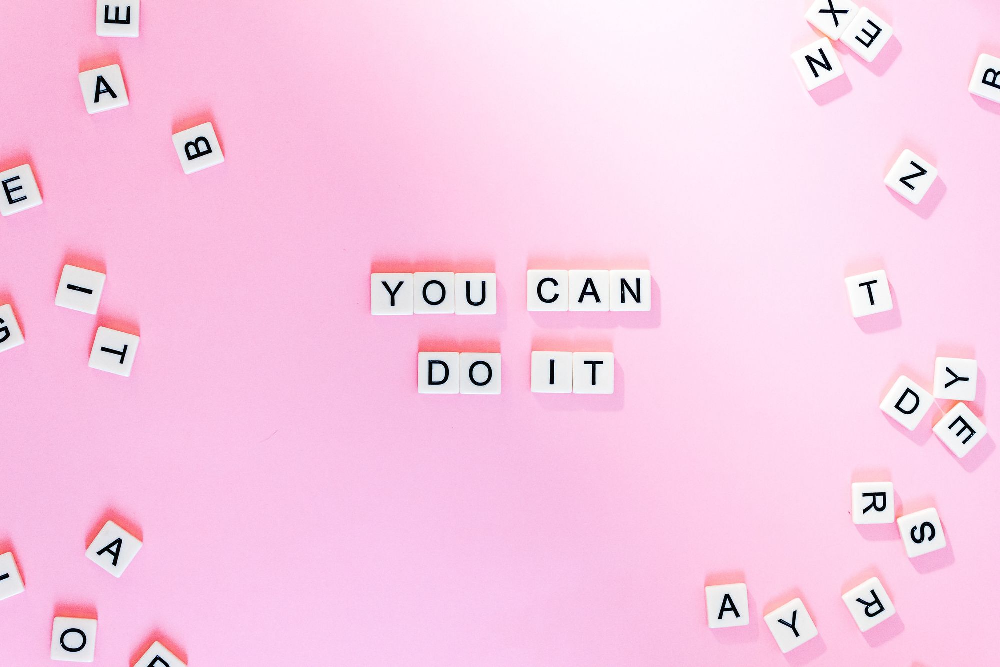 Stock photos of scrabble letters spelling, "You can do it".