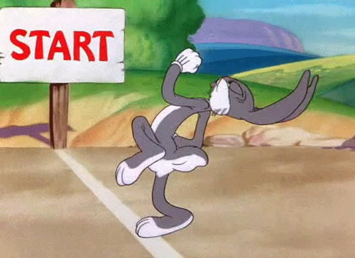 GIF of Bugs Bunny running at the start line of a race.